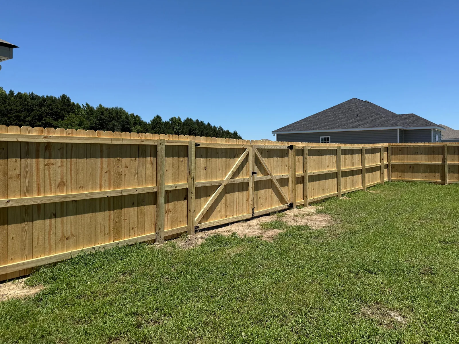 Wood fence with double gate